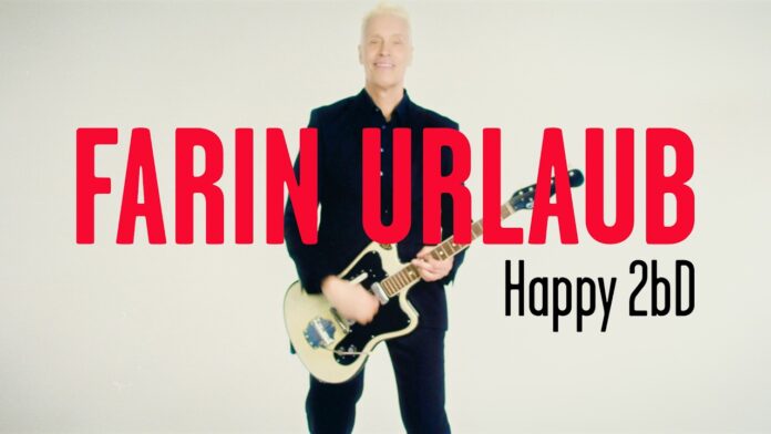 Farin Urlaub veröffentlicht neue Single „Happy 2bD“ Man with blond hair playing an electric guitar, with bold red text 'FARIN URLAUB' and black 'Happy 2bD' across a pale background.