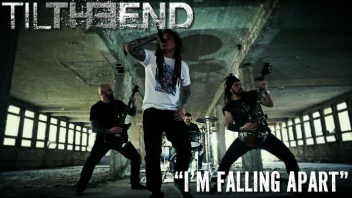 Til The End unterschreibt bei Lifeforce Records Four-member metal band performing in a derelict concrete space; vocalist center with mic, two guitarists flanking him, drummer in back; text overlays read 'TIL THE END' and 'I'M FALLING APART'
