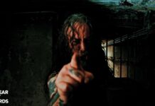 Benediction kündigt Besetzungswechsel an Man with long hair and tattoos points at the camera in a dark, grimy basement; Nuclear Blast Records logo appears in the bottom-left corner.