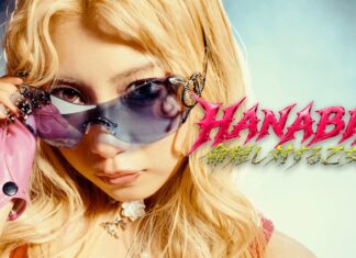 HANABIE.: Chika legt eine Pause ein Woman with long blonde hair wearing pink fingerless glove and reflective sunglasses, adjusting them, with bold pink 'HANABIE' logo on the right edge.