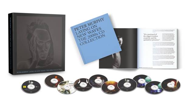 Boxed CD collection titled 'Peter Murphy Leaving on Waves: The 2000s CD Collection' with a dark box, a blue booklet, and multiple CDs laid out nearby.